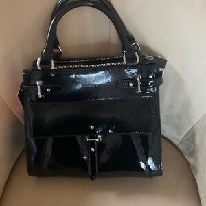 New Karen Millen black patent bag, 11” x 10” x 5.5”
Has Dustbag